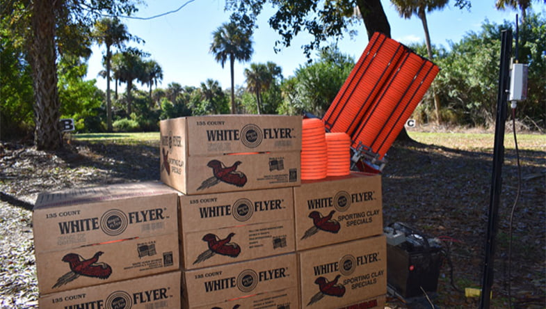 Shipping boxes filled with White Flyer targets, one of which is open to show them