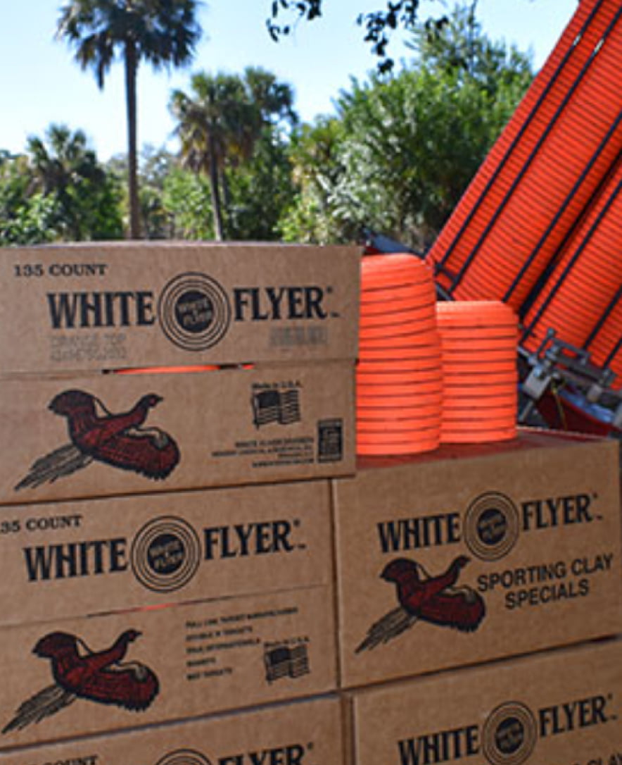 Shipping boxes filled with White Flyer targets, one of which is open to show them