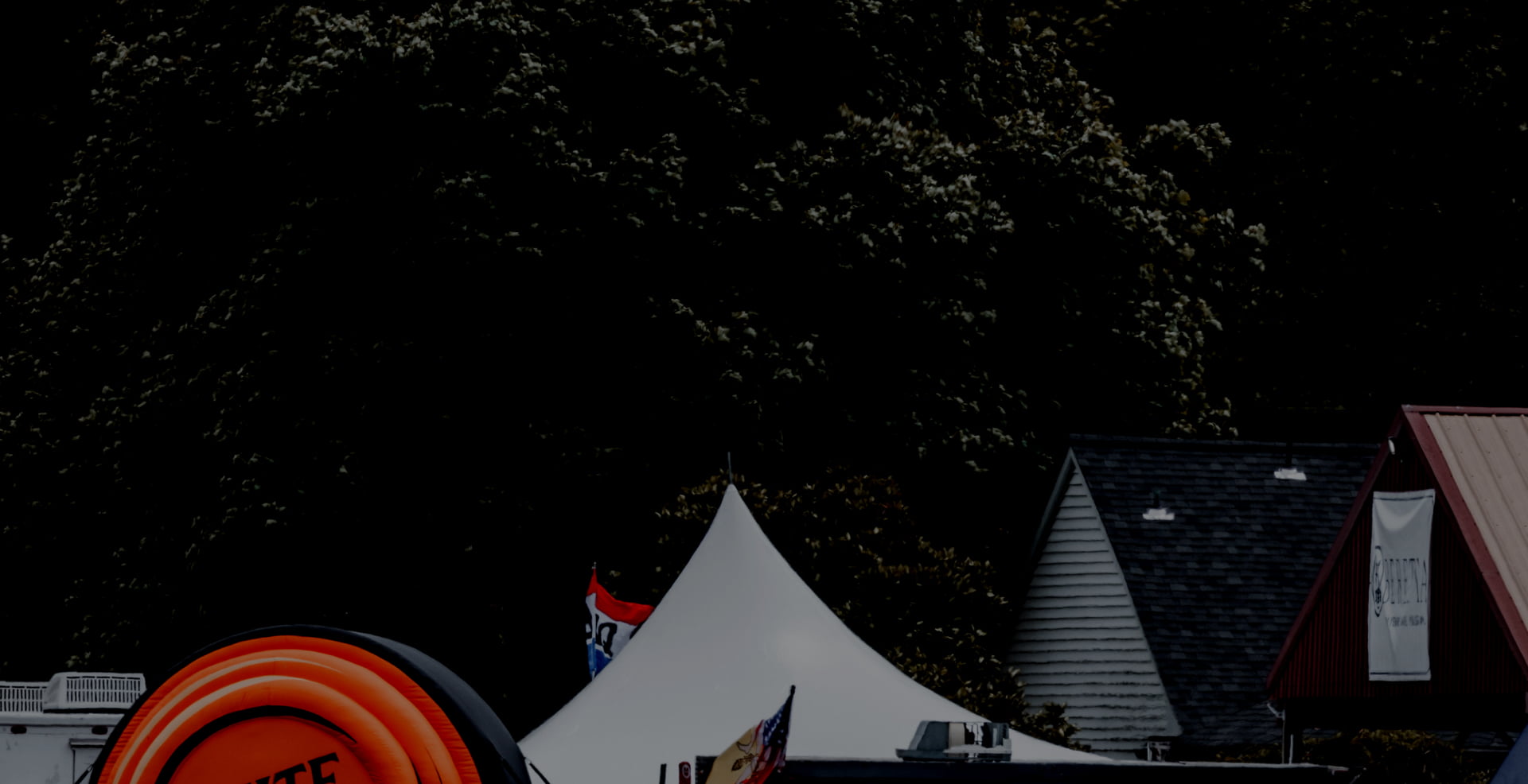 View above some tents and large blowup displays at a White Flyer event